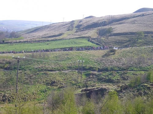 The start line.  Taken from Jessica's marshal point.  Believe me it is steeper than it looks!  The returning singletrack can also be seen.